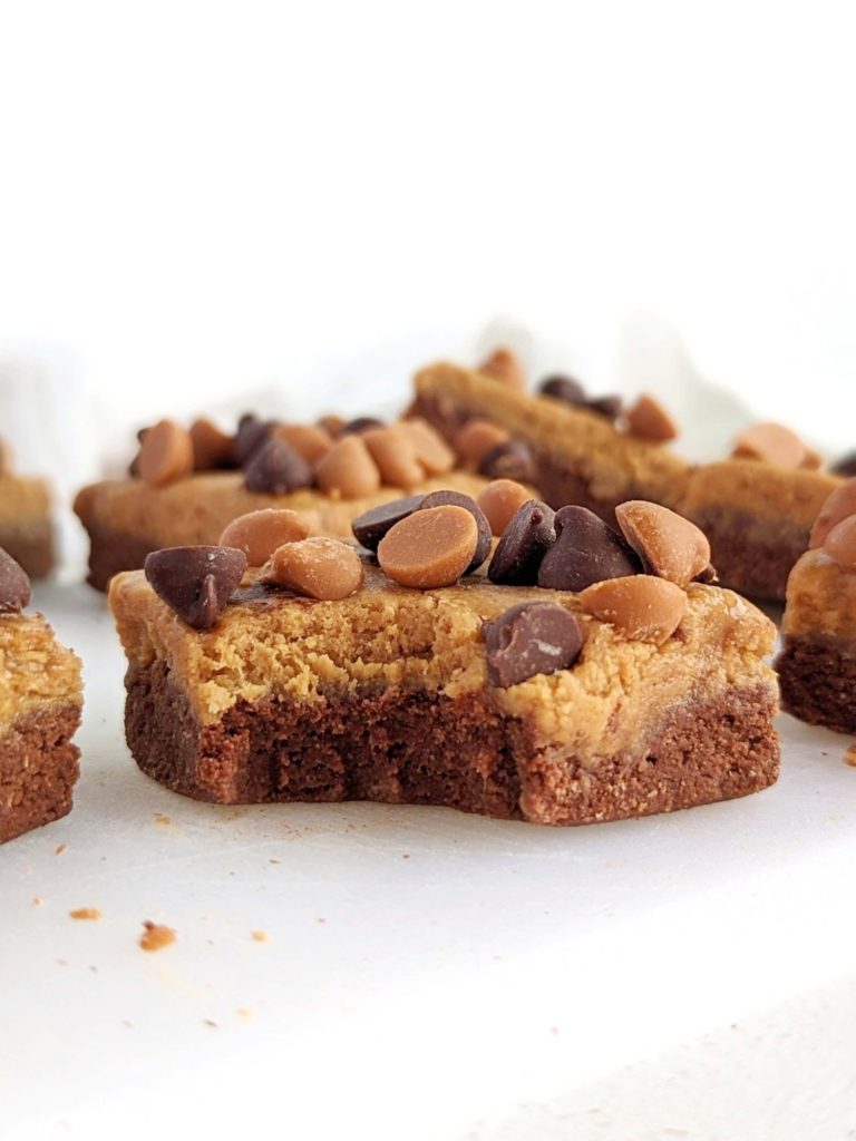 Soft and chewy Chocolate Butterscotch Protein bars with a base, caramel-y later and all the chocolate and butterscotch chips on top. Easy, no bake and healthy chocolate butterscotch squares for a sugar free treat.