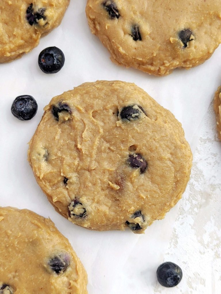 Just amazing Peanut Butter Blueberry Protein Cookies made with oat flour, peanut butter powder and no eggs for a gluten free, low fat and Vegan recipe! These high protein blueberry oatmeal cookies are a great healthy breakfast or post-workout treat.