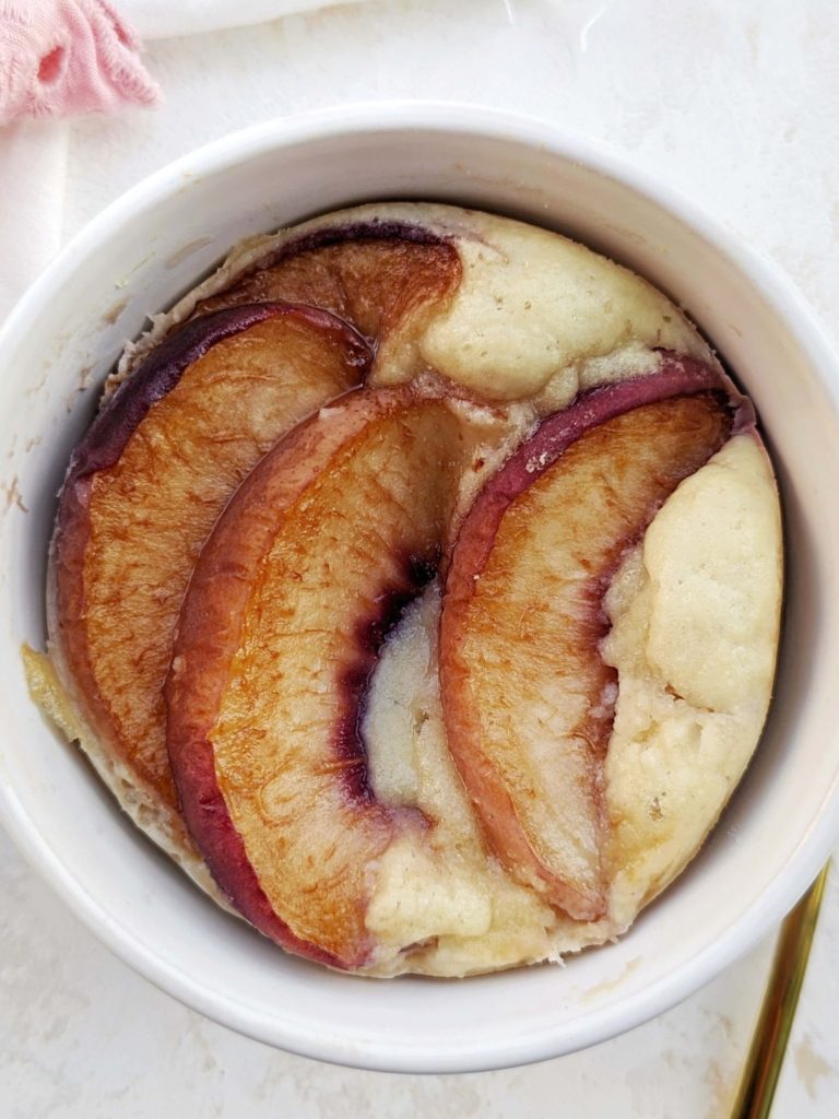 The perfect high Protein Peach Mug Cake with a ton of protein powder and egg whites, and no sugar or butter. Healthy peach mug cake is gluten free, low carb, and easily vegan too!