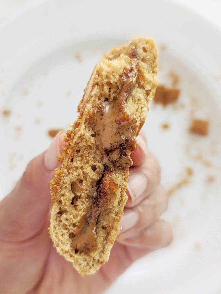 Triple Biscoff Stuffed Protein Cookie with crushed Biscoff biscuits in the dough, Speculoos protein powder and a cookie butter lava filling. These high protein Biscoff lava cookies are a healthy way to hit that Speculoos cookie butter craving.