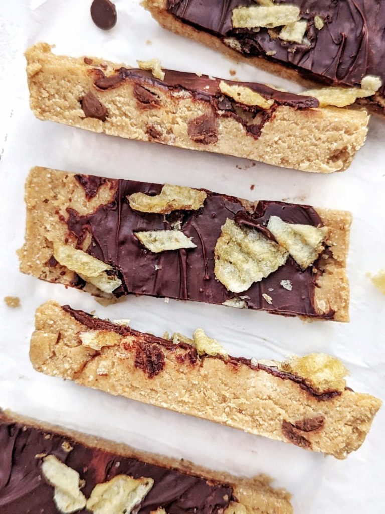 Sweet and Salty Chocolate Chip Protein Bars with Potato Chips on top! These healthy cookie dough protein bars are low fat, sugar free, gluten free and quite guilt-free too.