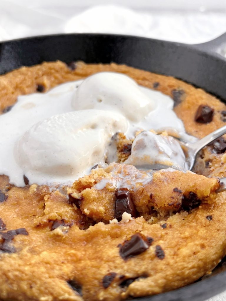 A truly extremely easy Chocolate Chip Protein Skillet Cookie made with a few healthy ingredients. This chocolate chip protein cookie uses applesauce, almond butter and protein powder, has no sugar and is quite a low calorie recipe!