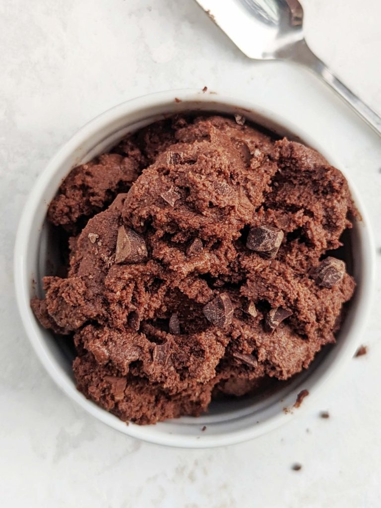 Quick and easy no bake Edible Protein Brownie Batter for one made in under 2 minutes! This single serve chocolate protein brownie batter uses protein powder for a sweetener, is gluten free, Vegan and an overall healthy snack, dessert or post workout treat.