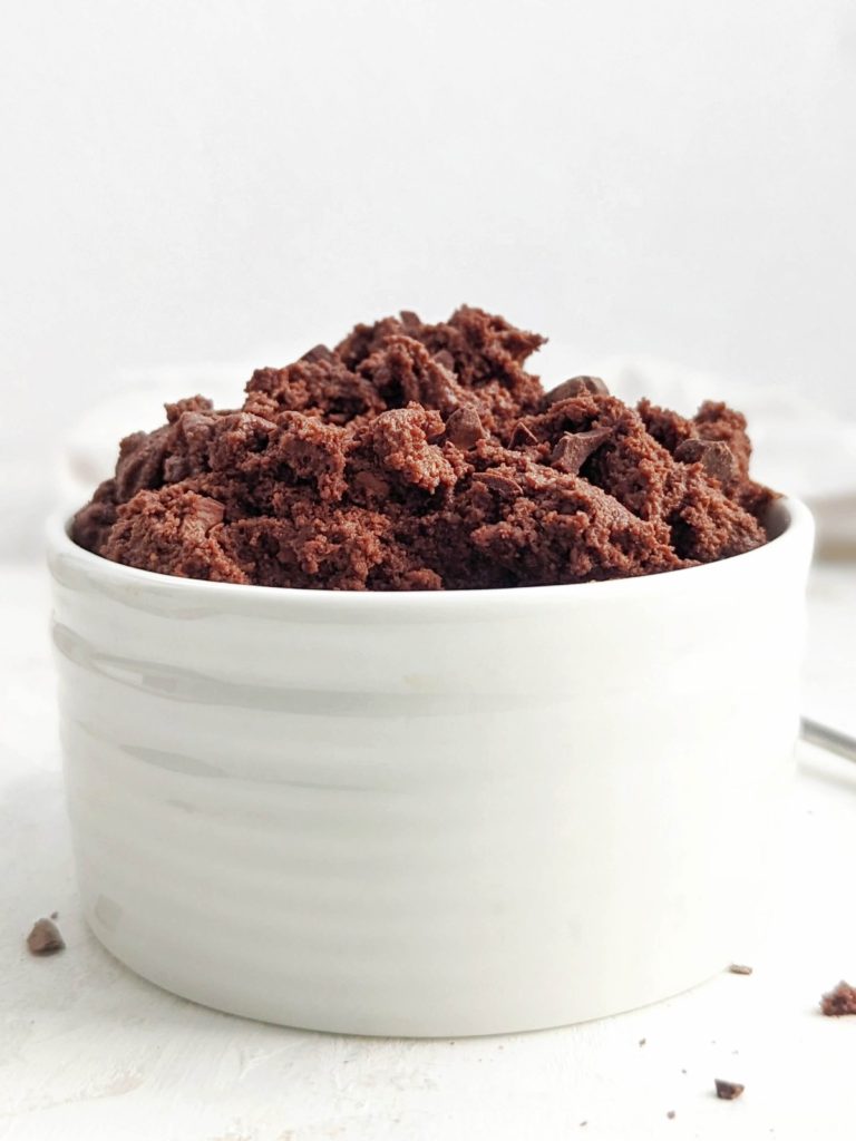 Quick and easy no bake Edible Protein Brownie Batter for one made in under 2 minutes! This single serve chocolate protein brownie batter uses protein powder for a sweetener, is gluten free, Vegan and an overall healthy snack, dessert or post workout treat.