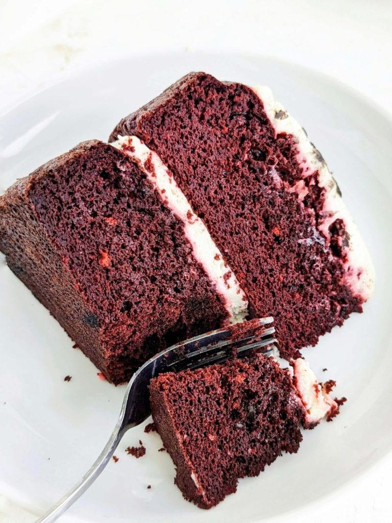 Amazing Protein Red Velvet Cake topped with a Greek yogurt and cream cheese frosting - truly the only one you will want. A high protein healthy red velvet cake sweetened with chocolate protein powder, and barely any fat - the ideal protein dessert!