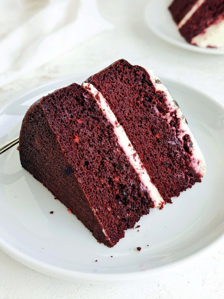 Amazing Protein Red Velvet Cake topped with a Greek yogurt and cream cheese frosting - truly the only one you will want. A high protein healthy red velvet cake sweetened with chocolate protein powder, and barely any fat - the ideal protein dessert!