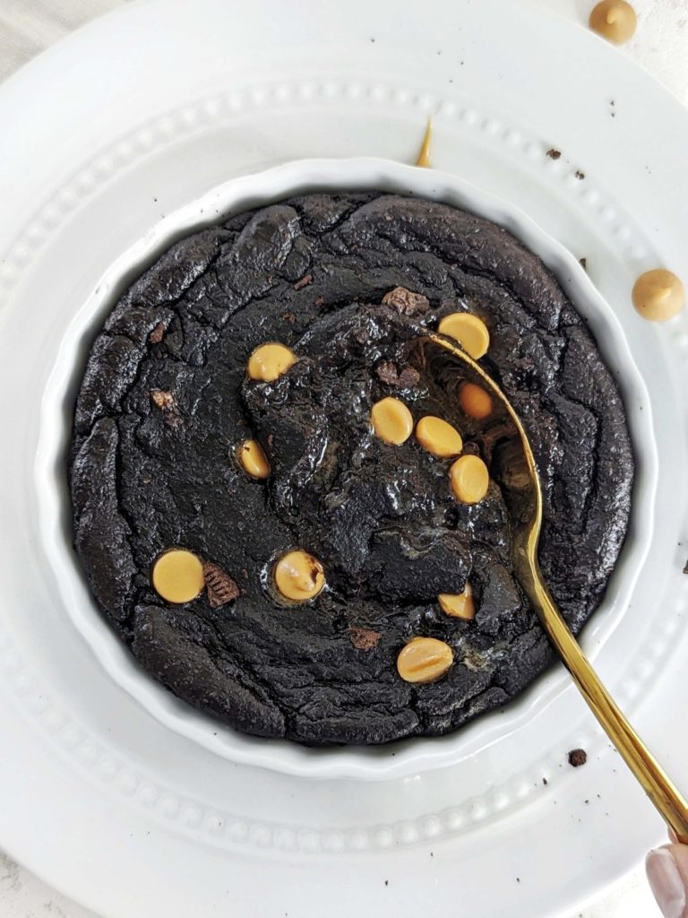 Picture perfect and perfect Halloween Protein Fudge Brownie for one, complete with the rich black cocoa and pumpkin spice chips. Healthy halloween fudge brownie uses protein powder for sweetness and is sugar free and low-carb too!