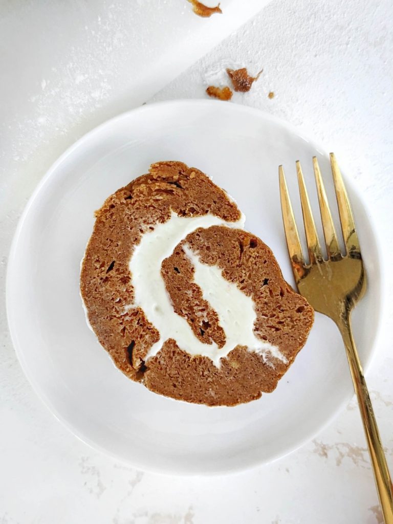 Gorgeous Protein Pumpkin Roll with protein cream cheese filling swirled inside a low fat and sugar free pumpkin cake. An easy, healthy pumpkin roll cake recipe to please any crowd!