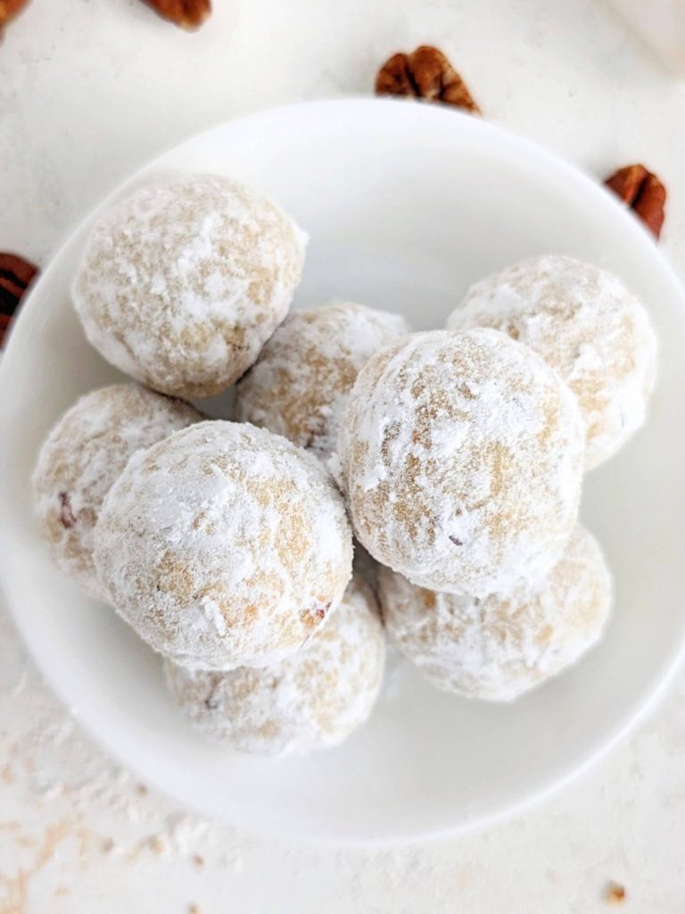 Melt-in-your-mouth Protein Snowball Cookies made healthy and sugar-free are perfect for the holidays! Easy Mexican wedding cookies have pecans, no butter and rolled in sugar-free powdered sugar.