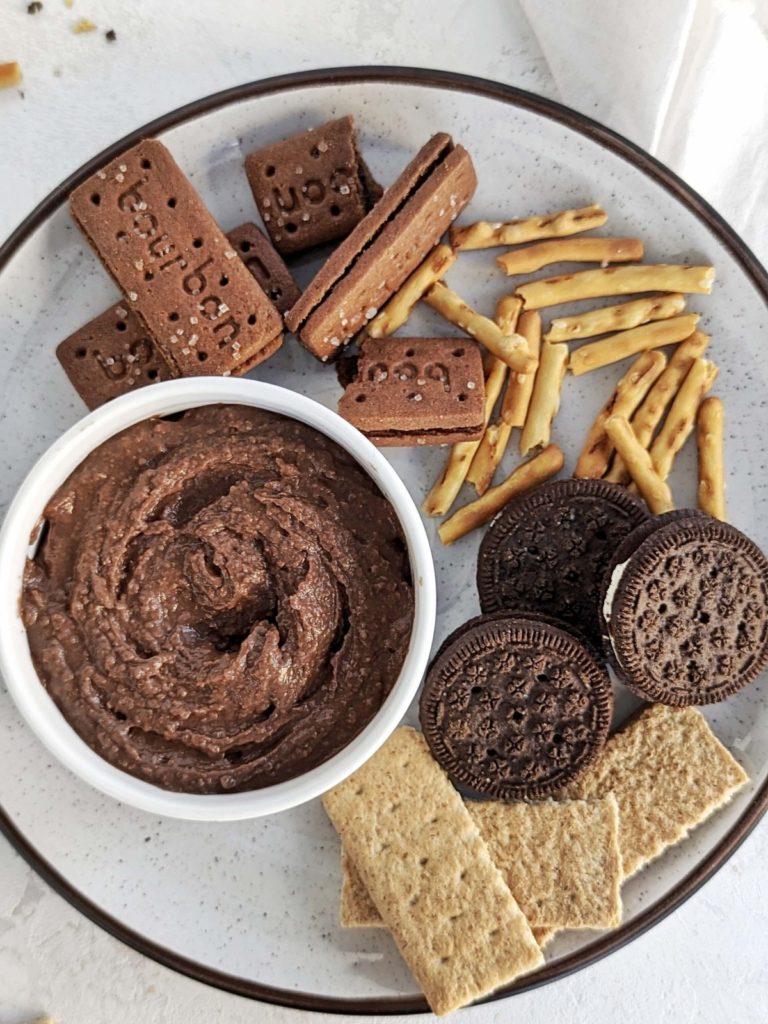 The best Chocolate Protein Hummus recipe made with chickpeas, protein powder and applesauce. Healthy chocolate chickpea dip is a great protein-packed snack for your next chip-and-dip party.