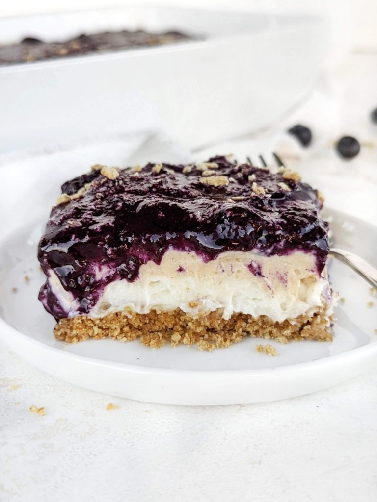 A real easy no-bake Blueberry Lasagna recipe with a graham cracker crust, protein vanilla and peanut butter pudding and homemade berry jam. Healthy blueberry delight sure to please a crowd!