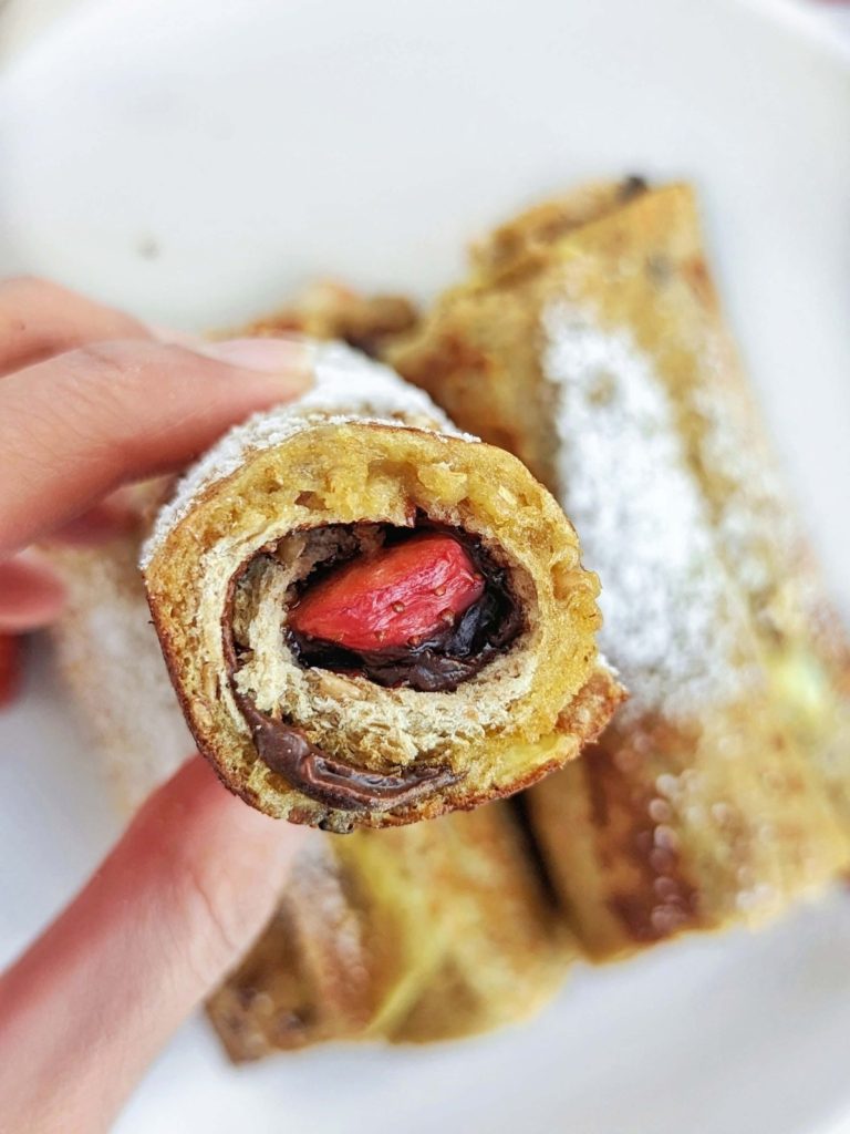 Perfect Protein French Toast Rolls with a high-protein chocolate spread and strawberry filling! Healthy french toast roll ups use protein powder and have no sugar added.