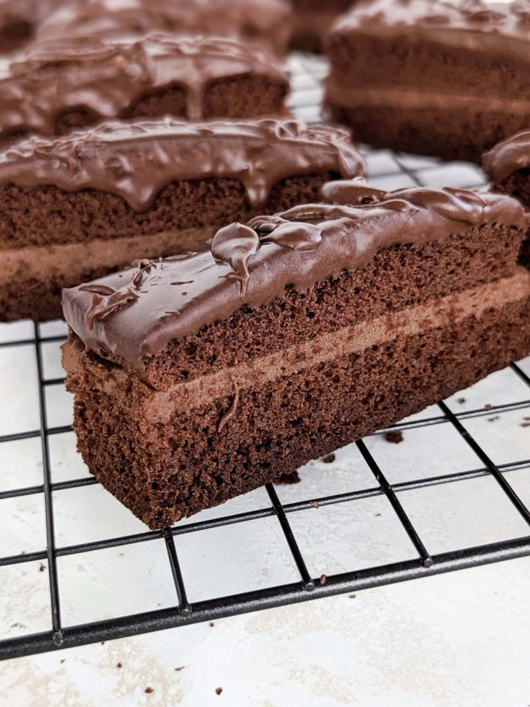 Healthy Frosted Fudge Cakes recipe is the best Little Debby copycat you can get; High protein chocolate cake sandwiched with protein chocolate frosting and topped with high protein chocolate fudge ganache. A low fat, sugar-free recipe.