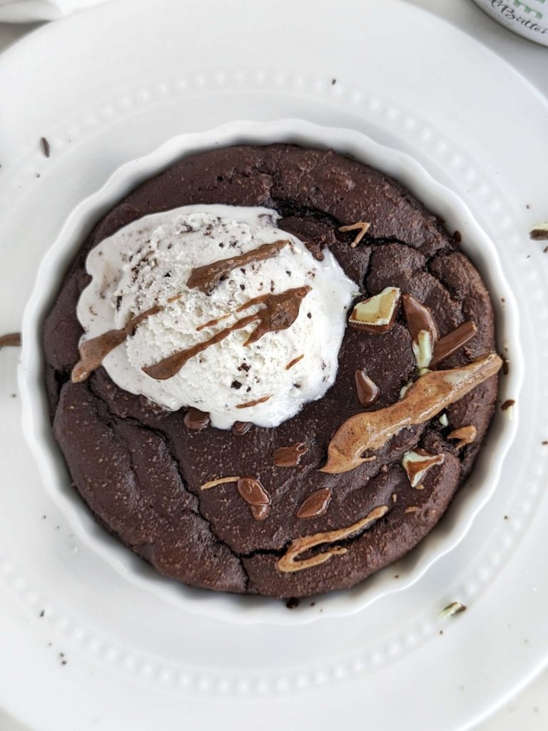 Indulgent Mint Chocolate Protein Dessert bowl that tastes like a fudgy half baked brownie! Easy, healthy single serve recipe with chocolate protein powder, mint chocolate candy and mint chocolate flavor almond butter too!