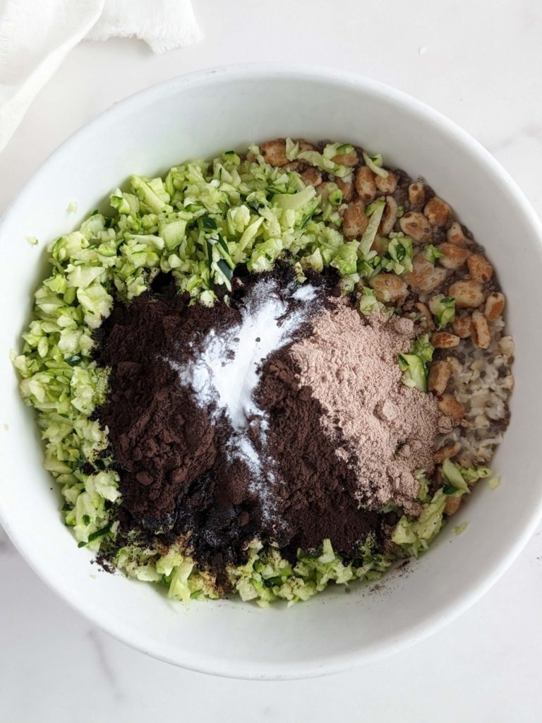 Oreo Protein Zucchini Oats is the best ever breakfast you will have! Creamy high protein oatmeal with shredded zucchini is a low calorie, high volume meal that actually tastes like a bowl of Oreo!