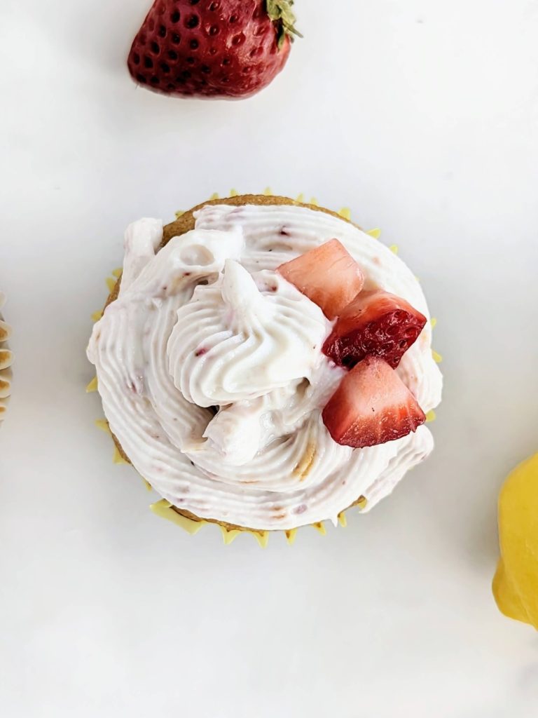 Strawberry Lemon Protein Cupcakes with a strawberry filling and strawberry lemon protein frosting! Healthy, low fat strawberry lemonade cupcakes with protein powder and no added sugar.