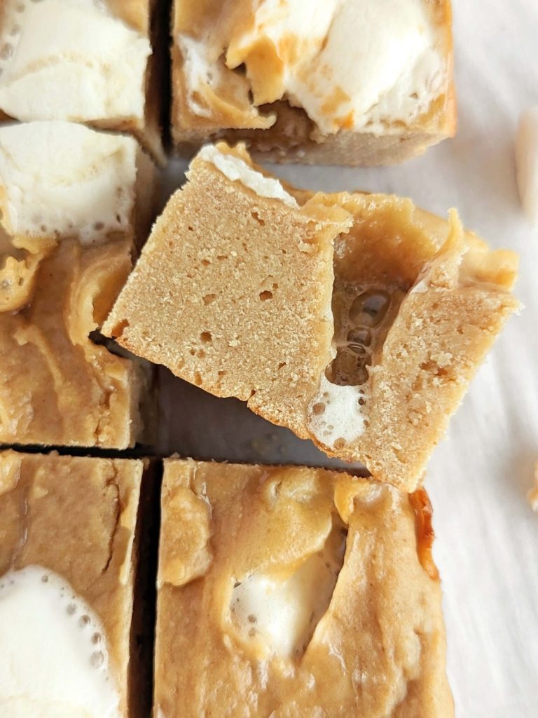 Fluffernutter Protein Bars loaded with peanut butter flavor and marshmallows are the perfect postworkout snack on-the-go or for a quick pick-me-up. Easy, healthy, low fat, low sugar and high protein fluffernutter bars!