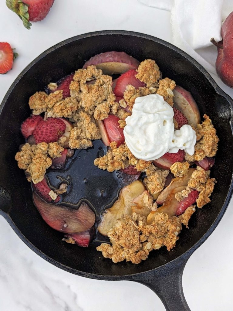 Healthy Strawberry Apple Crisp that's as delicious as it is nutritious! A sweet, but added sugar free blend of apples and strawberries with a high protein, low fat, sugar free and gluten free oat crumble.