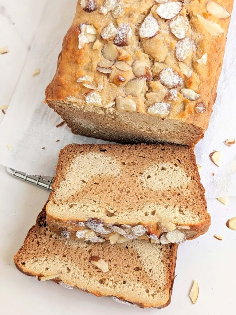 Almond Croissant Loaf is a high protein breakfast dream come true! Healthy almond croissant bread is a high protein loaf cake with heathy almond frangipane and no sugar!