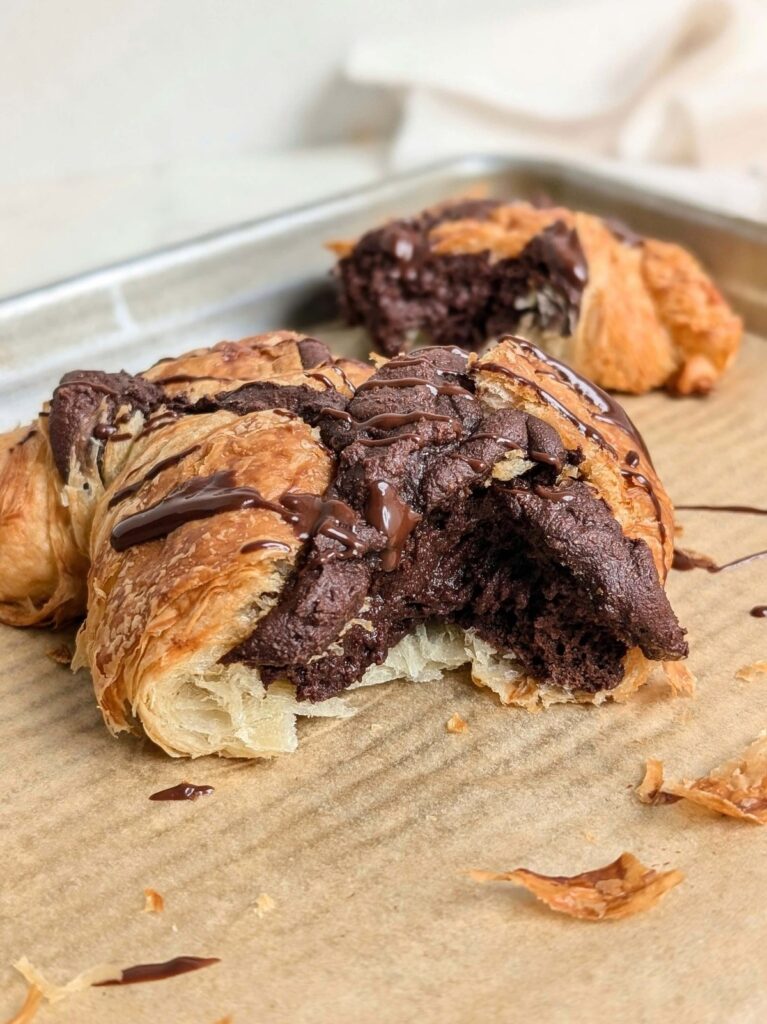 A truly amazing Brownie Croissant recipe that’s high protein and sugar free! Healthy brownie croissant is a flaky croissant filled with a high protein brownie batter - breakfast goals!