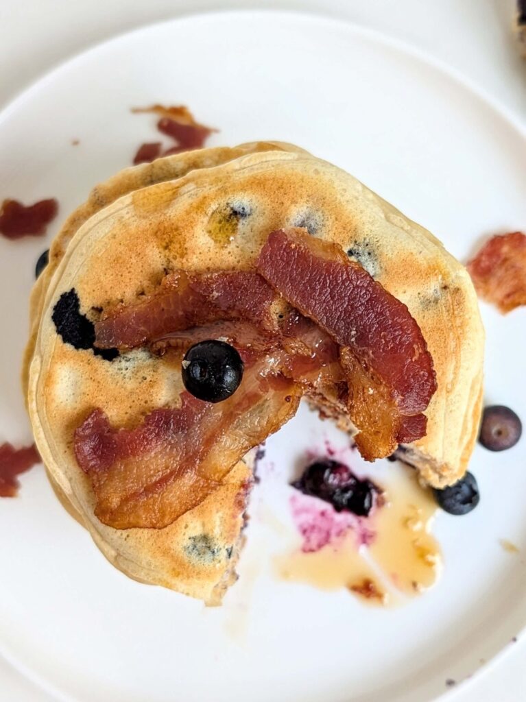 Combining the sweet tang of blueberries with the savory crunch of bacon, these Blueberry Bacon Protein Pancakes are a flavor explosion. Packed with protein to fuel your day, they're a delicious and satisfying meal to kickstart your morning.