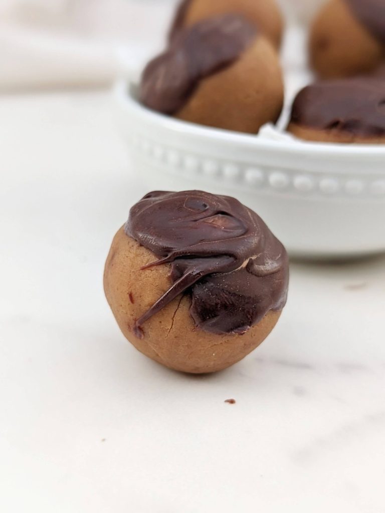 Double Peanut Butter Protein Truffles made with the nut butter and powdered peanut butter. Dip them in some melted chocolate and make high protein buckeye balls! A pretty perfect snack, dessert, or post workout treat!