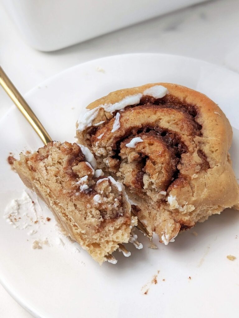 Soft, fluffy but Healthy Protein Cinnamon Rolls topped with protein powder Cream Cheese Icing! These protein powder cinnamon rolls are made with a sugar free filling and icing and only a little butter - the perfect easy, skinny, low calorie cinnamon buns to satisfy your cravings!