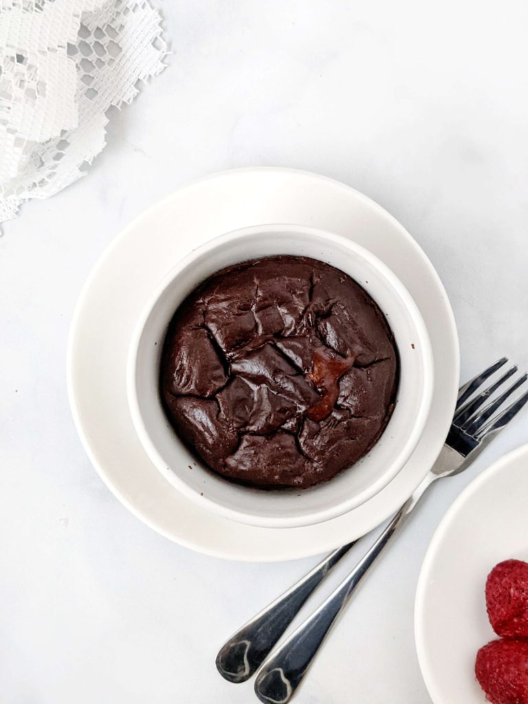 An easy and healthy Protein Chocolate Lava Cake for One made with protein powder and cocoa powder. This protein lava cake is sugar free and has the molten chocolate center with no butter needed - a perfect indulgent dessert!