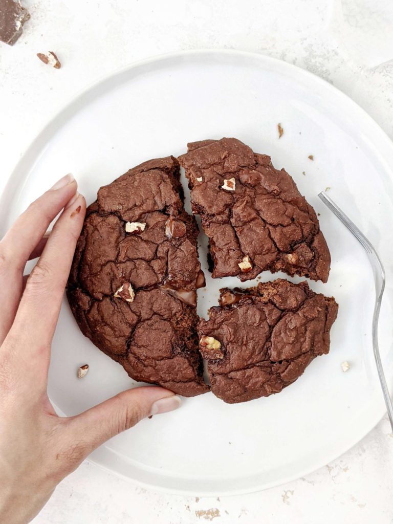 A giant Single Serving Chocolate Protein Cookie made with oat flour, greek yogurt and protein powder. This healthy single serve protein cookie is gluten free, sugar free, oil free and egg free; Easily Vegan and a great post workout treat or healthy dessert.