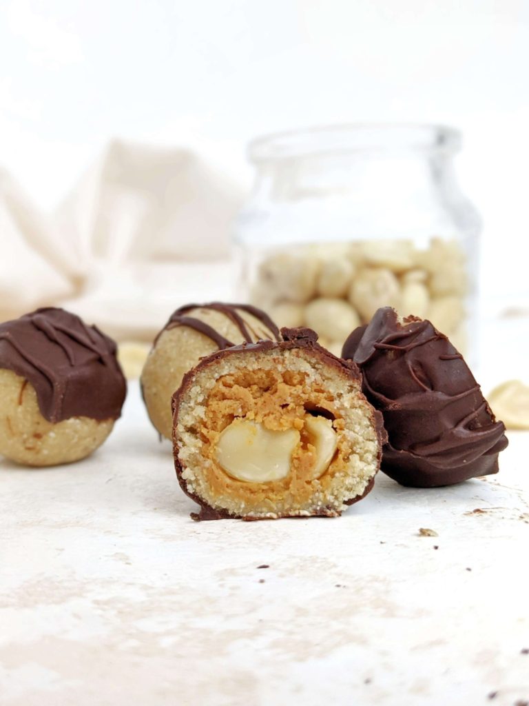 The perfect Snickers Protein Balls with all the candy layers - nougat, caramel, peanuts and chocolate - but healthy and easy too! These no bake Snickers protein bites are sweetened with protein powder so sugar free, and actually low fat, gluten free and Vegan too!