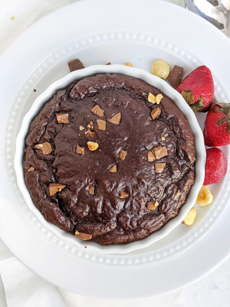 A super rich Half Baked Protein Fudge Brownie with perfect fudgy sides and gooey center! This single serving chocolate fudge protein brownie in a mug uses a ton of protein powder, has no sugar or oil, and is flourless too!