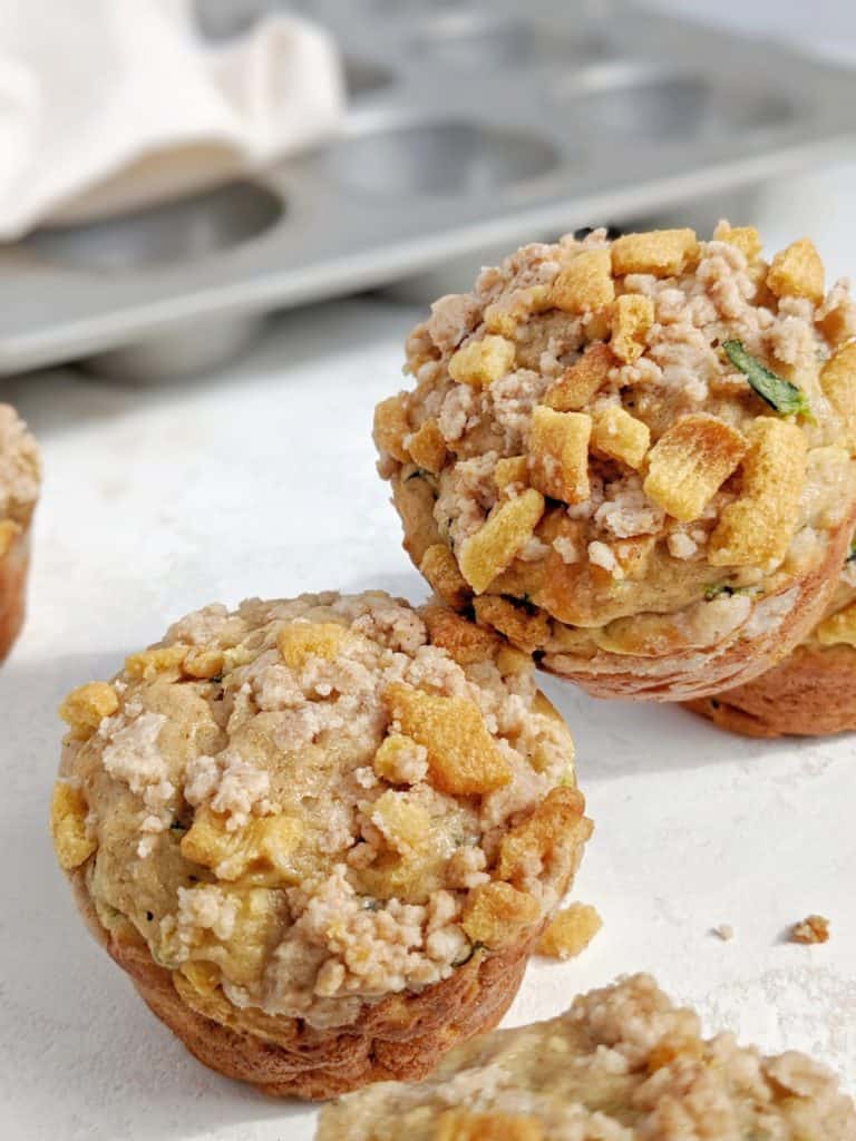 Just amazingly good Protein Zucchini Muffins topped with Cinnamon Crunch Streusel! These high protein cinnamon zucchini muffins use protein powder and Greek yogurt, have only a little oil and make a great healthy and low calorie zucchini recipe.