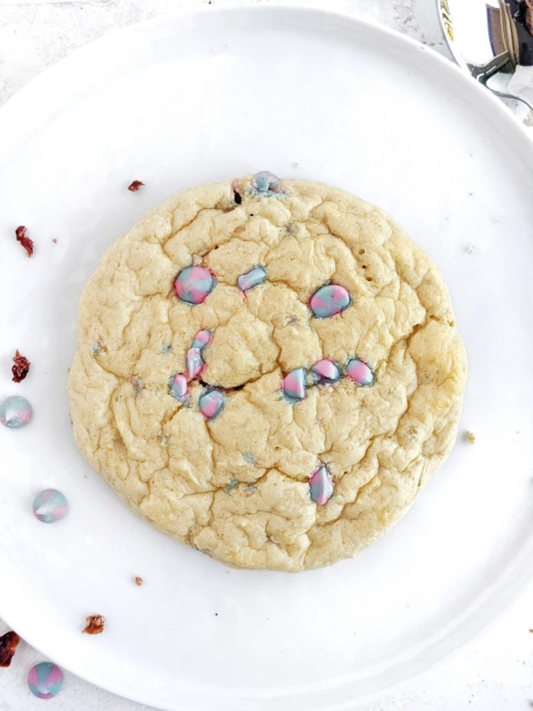 A loaded, low calorie Protein Sugar Cookie recipe filled with white chocolate chips! This protein powder sugar cookie is soft, sweet and actually healthy with applesauce and yogurt, but no butter or sugar!