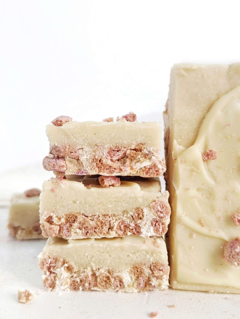 Pretty and tasty Milk and Cereal Protein Bars for a low calorie, low fat, high protein breakfast, snack or post-workout treat. This healthy milk n cereal bars recipe uses protein powder and low sugar cereal and a ton of greek yogurt for those layers!