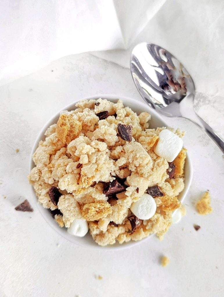 Incredible S’mores Protein Cookie Dough complete with mini marshmallows, chocolate and grahams. This s’mores cookie dough uses oat flour and protein powder, for a healthy, gluten free no bake dessert.