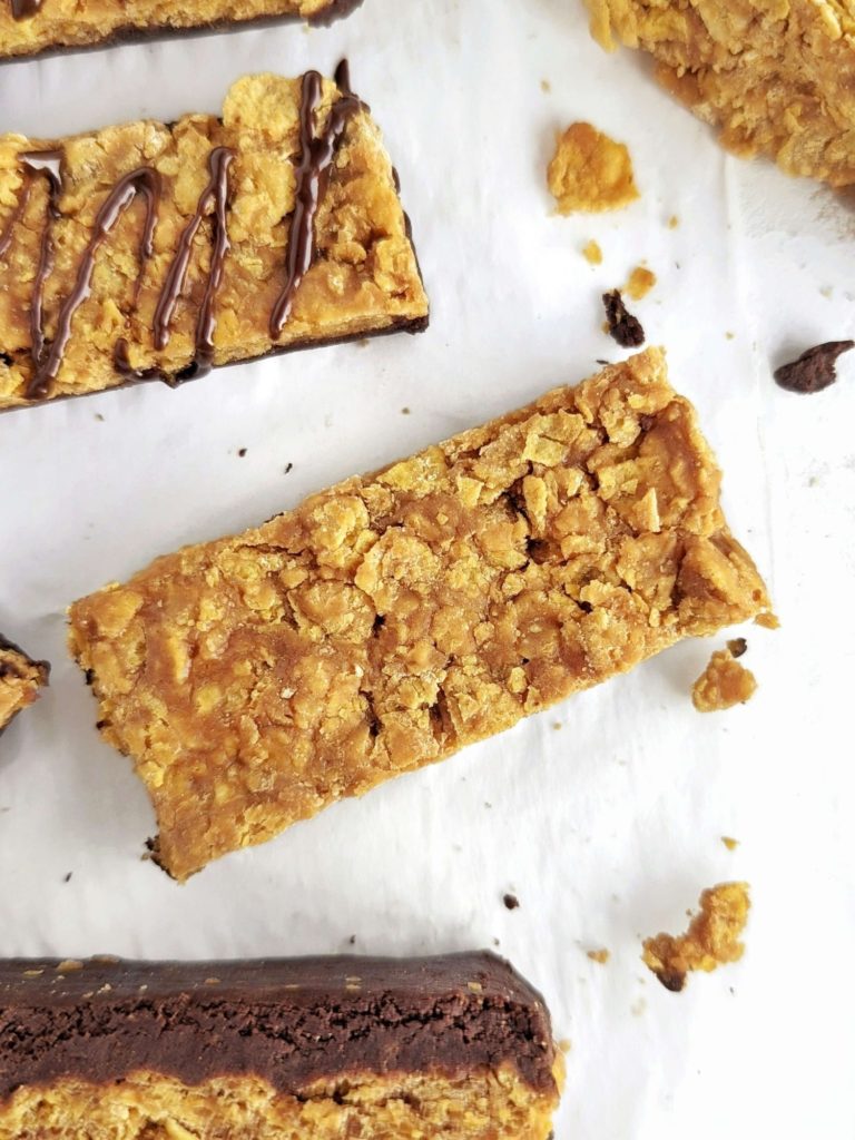 Homemade Butterfinger Protein Bars for your sugar free candy bar cravings with actual nutrition! This healthy Butterfinger recipe is made with corn flakes cereal, protein powder and creamy + powdered peanut butter and has no candy corn!