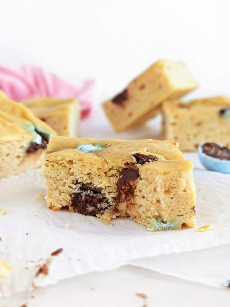 Mini Egg Protein Blondies so good you won’t believe they have no butter or extra sugar. Healthy Cadbury mini egg blondies use protein powder and a ton of Greek yogurt for a real great Easter recipe.