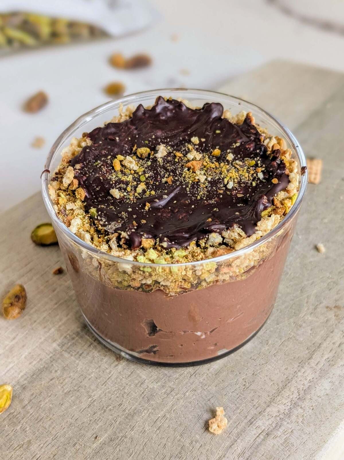 Easy and Healthy Dubai Chocolate Dessert as a protein packed alternative to the Viral chocolate bar. High protein Dubai chocolate dessert has a protein chocolate yogurt base and crushed pistachios and cereal for that crunch!