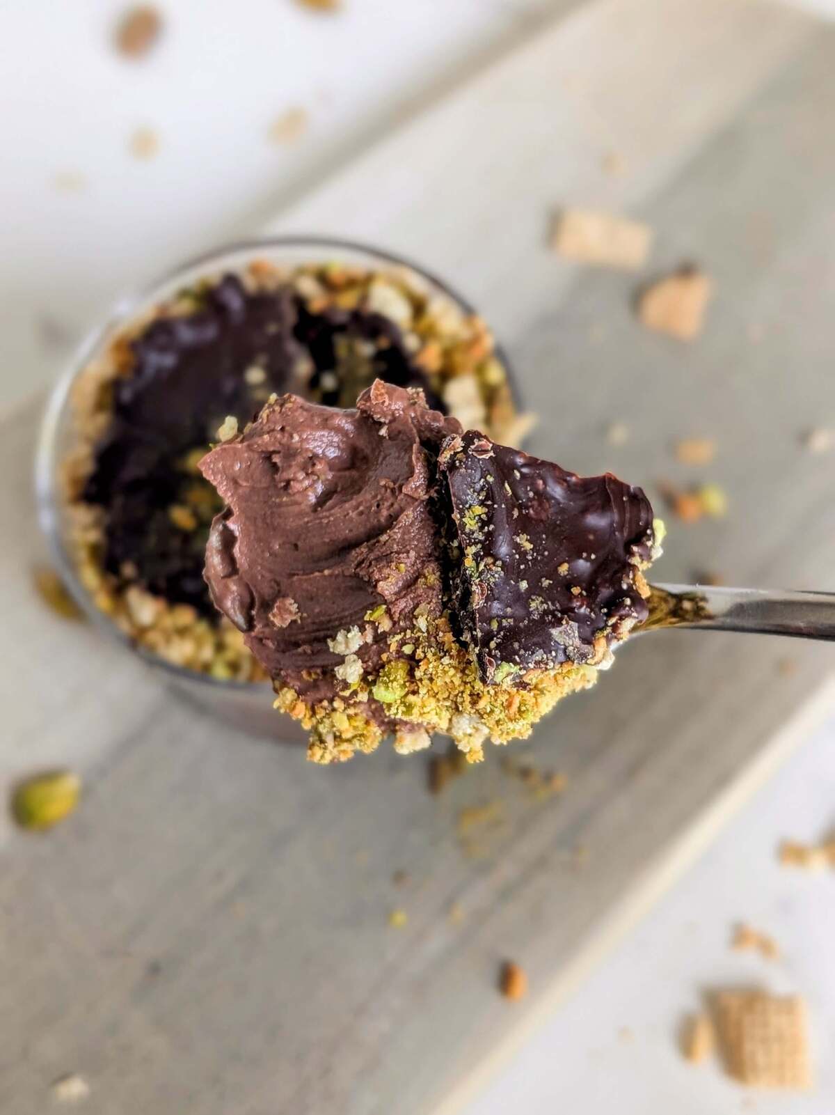 Easy and Healthy Dubai Chocolate Dessert as a protein packed alternative to the Viral chocolate bar. High protein Dubai chocolate dessert has a protein chocolate yogurt base and crushed pistachios and cereal for that crunch!