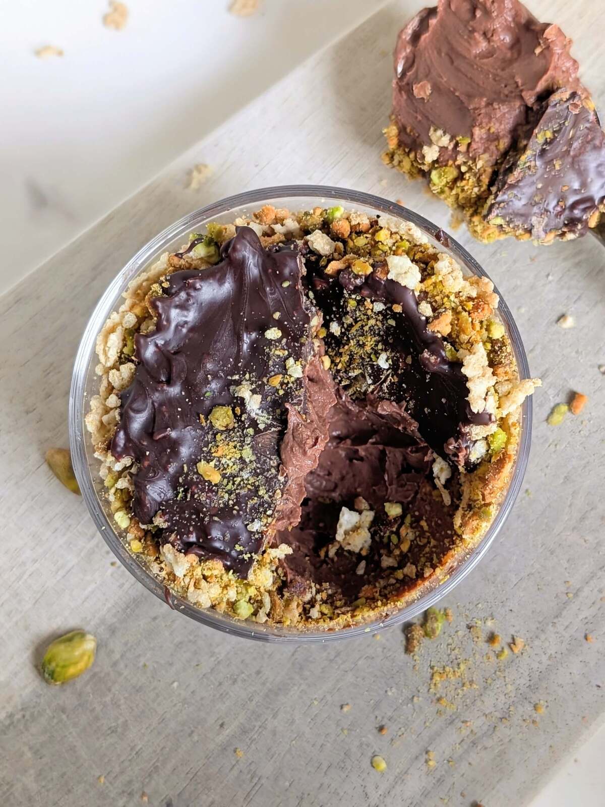 Easy and Healthy Dubai Chocolate Dessert as a protein packed alternative to the Viral chocolate bar. High protein Dubai chocolate dessert has a protein chocolate yogurt base and crushed pistachios and cereal for that crunch!